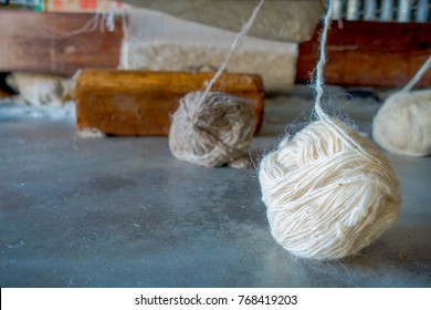 Close up of a whool to work on loom manufacturing whool shawl clothing in Nepal