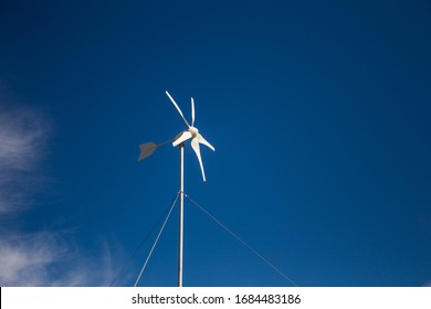 Close Up Wide Angle View Of A Spinning Wind Turbine Charging Batteries In An Off The Grid Electricity Installation On A Farm In The Karoo In The Western Cape Of South Africa