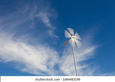 Close Up Wide Angle View Of A Spinning Wind Turbine Charging Batteries In An Off The Grid Electricity Installation On A Farm In The Karoo In The Western Cape Of South Africa