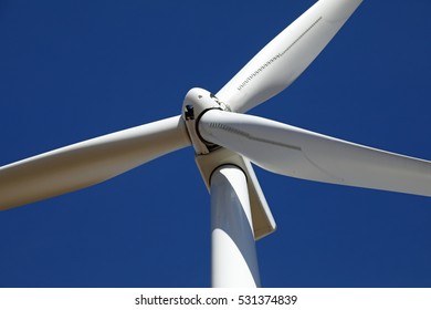 Close Up Of A Wind Turbine With Blades.