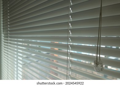 Close Up Window With White Venetian Blinds.