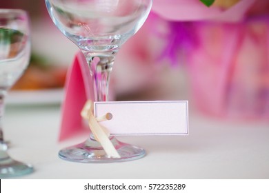 Close Up Of Wine Glass And Name Card. Table Setting At Wedding. Card For The Name Of The Guest At Engagement Party