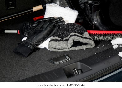 Close Up Of Winter Emergency Automobile Kit, Hat Gloves Scarf Boots In The Trunk Of A Car