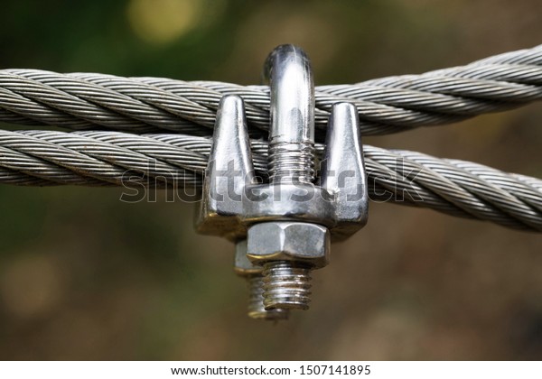 Close up wire rope\
clamp and steel rope 