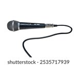 Close up of a wired microphone with a black body and silver grille. Connected via an XLR cable