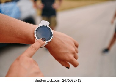 Close Up Woman Analyzing Workout Data on Smartwatch Post Run. - Powered by Shutterstock