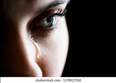 Close up of woman crying - Shutterstock ID 1578927358