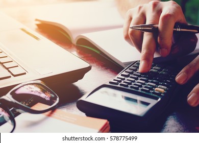 Close Up Woman Doing Finance At Home Office With Calculate Expenses