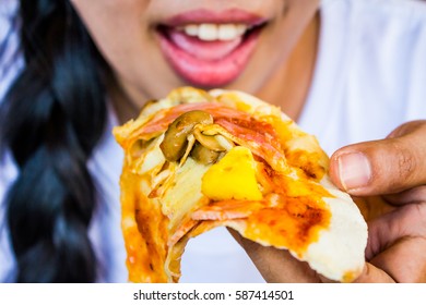 Close Up Woman Eating Hot Hawaiian Pizza