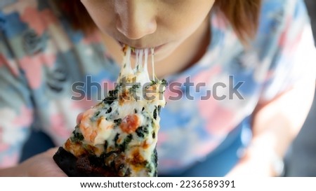 Close up woman eating pizza 