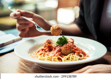 Close Up Of Woman Eating Spaghetti Meatball