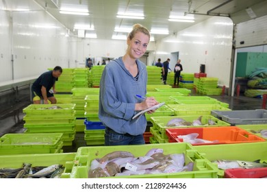 Close Up Of Woman And Fish Market