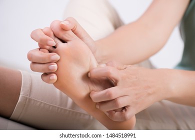 Close up woman foot scratch the itch by hand at home. Healthcare and medical concept. - Shutterstock ID 1484518991