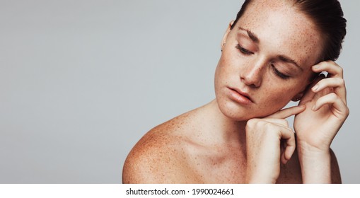 Close up of woman with freckles on body. Portrait of woman showing her beautiful freckles.