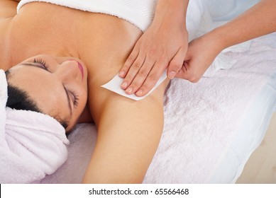 Close Up Of Woman Getting Waxing Armpit B Y Beautician In A Beauty Salon