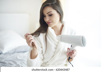 Close Up Of Woman With Hair Dryer 
