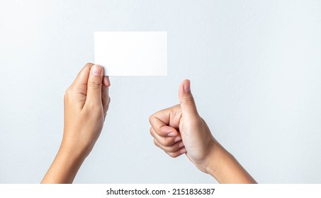 Close Up of woman hand holding blank paper isolated on white background
 - Powered by Shutterstock