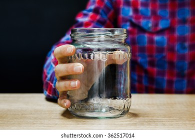 Close Up Of Woman Hand Holding Empty Jar Ready To Be Filled With Ingredients