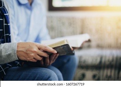 Close Up Of Woman Hand Holding And Read Bible With His Friends Indoor, Christian Background With Copy Space