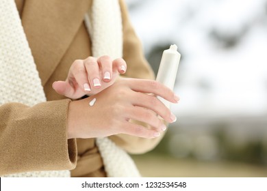 Close Up Of A Woman Hand Hydrating Skin Applying Cream In Winter