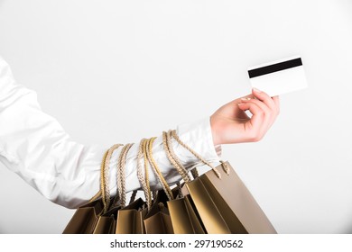 Close Up Woman Hand With Many Shopping Bags And Credit Card 