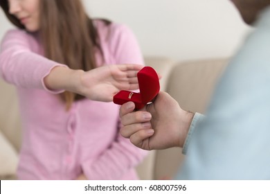 Close Up Of Woman Hand Rejecting, Turning Down Marriage Proposal, Engagement Ring Box, Indoor. Asking To Marry, Requesting Hand. Unpleasant Surprise, Bad Birthday Gift, Disappointment In Love, Breakup