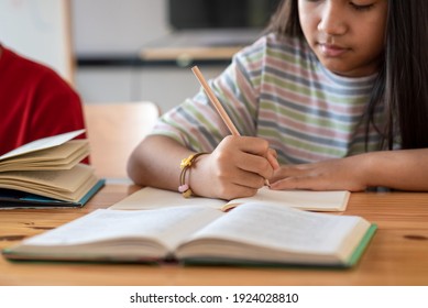 Close Up Of A Woman Hand Taking Notes At Home.