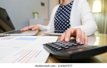 Close Up Woman Hand Using A Calculator.