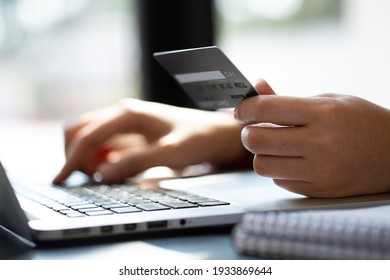 Close Up Woman Hand Using Credit Card And Smartphone Laptop For Buying Online Shopping