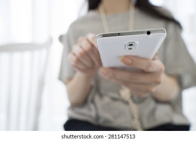 Close Up Of Woman Hand Using Mobile Phone