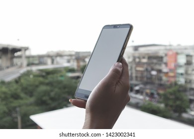 Close up woman hand using smart phone. - Shutterstock ID 1423002341