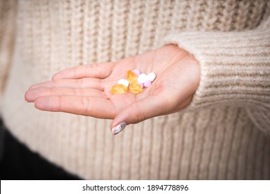 Close Up Of Woman Hand With Vitamins, Minerals And Supplements. B12, D3, K2, Selenium, 