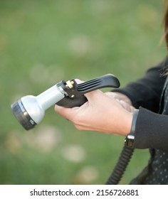 Close Up Woman Hands Connecting Black Garden Hose And Spray Nozzle Close Up