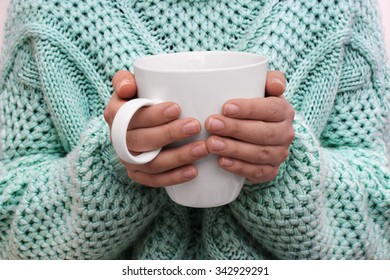 Close up of woman hands holding cup of coffee - Shutterstock ID 342929291