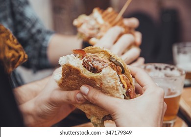 Close Up Of Woman Hands Holding Delicious Burger