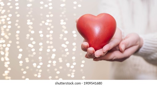 Close Up Of Woman Hands Holding Giving Red Heart Shape. People, Love, Charity, Health And Family Concept.