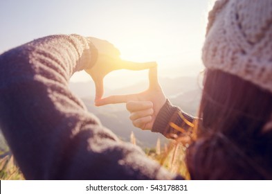 Close Up Of Woman Hands Making Frame Gesture With Sunrise On Moutain, Female Capturing The Sunrise, Future Planning, Sunlight Outdoor.