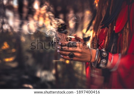 close up of woman hands with shamanic fire outdoors Foto d'archivio © 