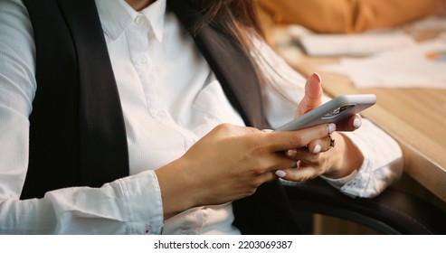 Close Up Woman Hands Typing Nervously Being Upset Of Bad Business Report Results Sitting In Office. Busy Business Woman Receiving A Message From Hospital Concerning Family Member.