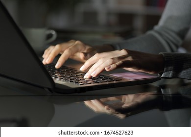 Close Up Of Woman Hands Typing On Laptop At Night On A Desk At Home