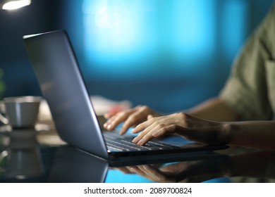 Close Up Of A Woman Hands Typing On Laptop In The Night At Home