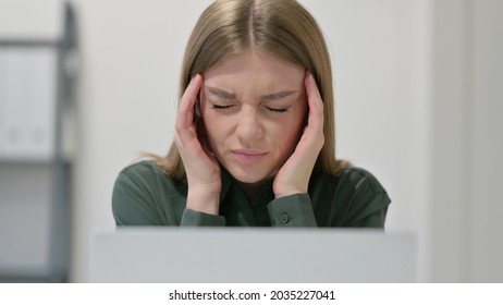 Close Up of Woman having Headache while using Laptop 