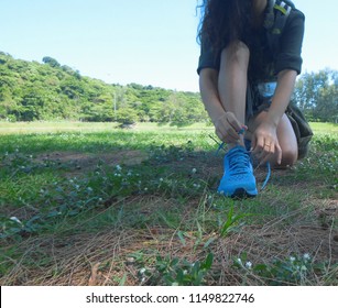 Close Up Of Woman Hiker Or Tourist Legs With Shoes Walking Away At Forest Trail To Camp