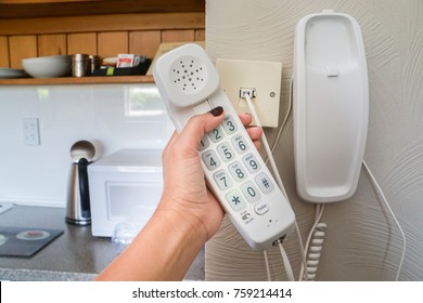 Close Up Woman Hold Landline Telephone At The House Wall