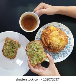 Close Up Of Woman Holding Avocado Toast As Fresh Snack.