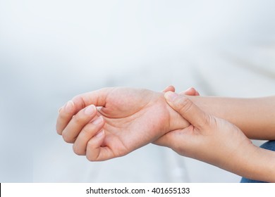 Close up woman holding her wrist symptomatic Office Syndrome - Shutterstock ID 401655133