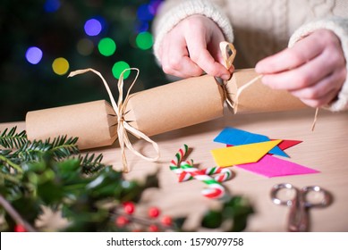 Close Up Of Woman Making Homemade Eco Friendly Christmas Cracker From Sustainable Materials