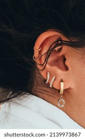 Close Up Of The Woman With Multiple Piercings On The Ear