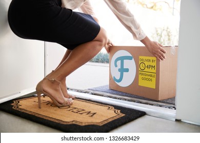 Close Up Of Woman Opening Front Door To Fresh Food Home Delivery In Cardboard Box Outside Front Door