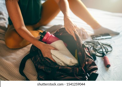 Close Up Of Woman Packing Sport Bag